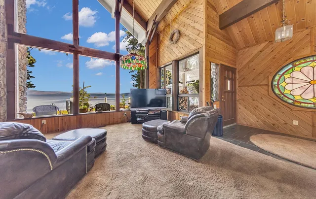 a view of a dining room with furniture and chandelier