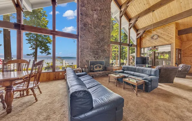 a bathroom with a granite countertop sink and a large mirror