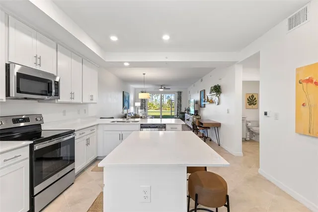a kitchen with cabinets a sink and appliances