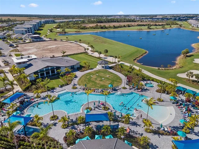 an aerial view of residential houses and outdoor space