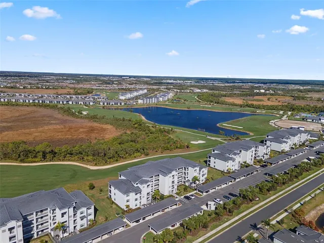 a front view of a building with a garden