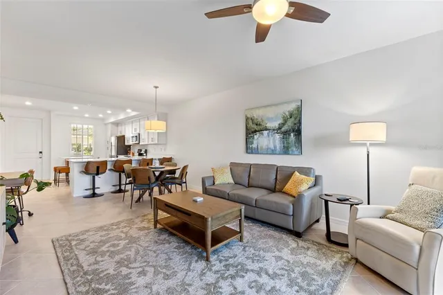 a living room with furniture and a lamp