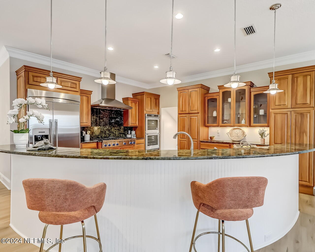 14192 Tomas Point Lane Jacksonville, FL 32225 - Photo 54 of 172 a kitchen with stainless steel appliances granite countertop a dining table chairs and white cabinets