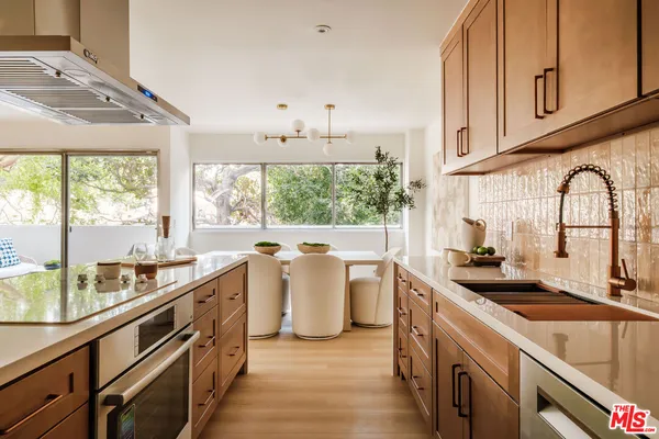a kitchen with a sink and a stove