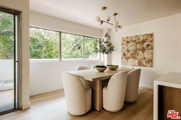 a view of a dining room with furniture window and outside view