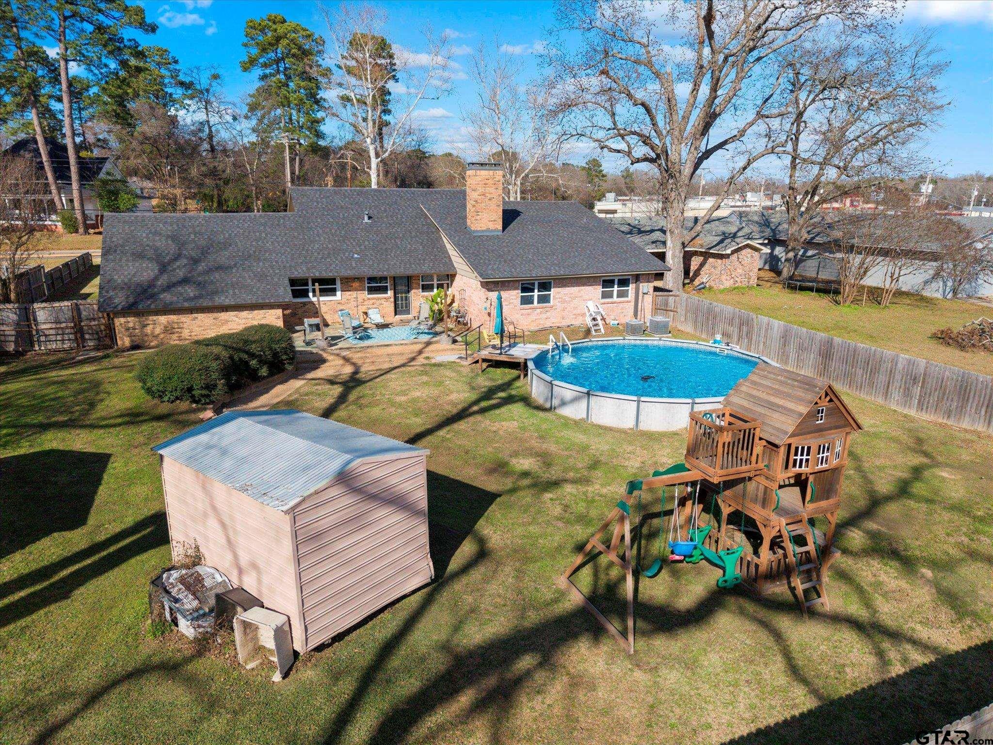 337 Daingerfield Street Pittsburg, TX 75686 - Photo 11 of 40 an aerial view of a house with swimming pool and furniture