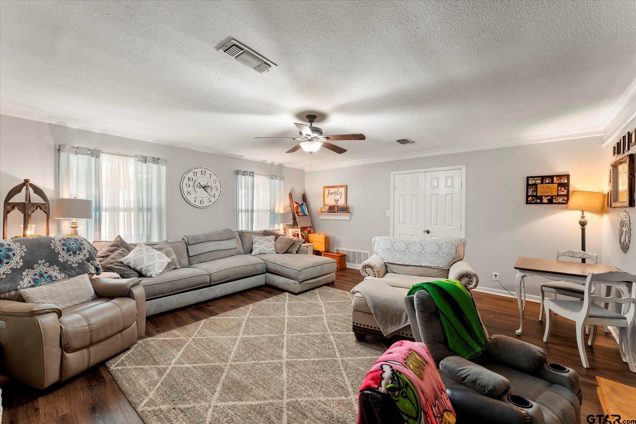 337 Daingerfield Street Pittsburg, TX 75686 - Photo 14 of 40 a living room with furniture and a chandelier