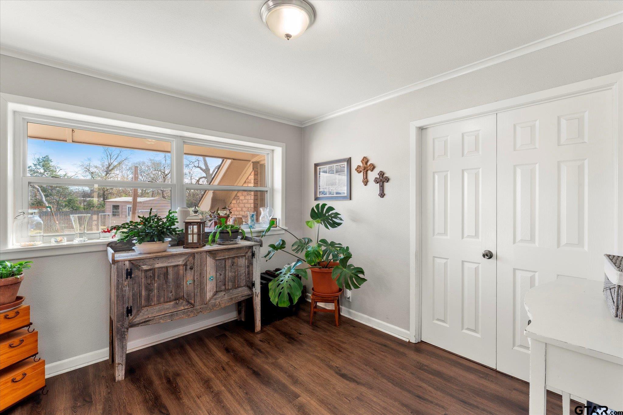 337 Daingerfield Street Pittsburg, TX 75686 - Photo 16 of 40 wooden floor in an empty room with a window