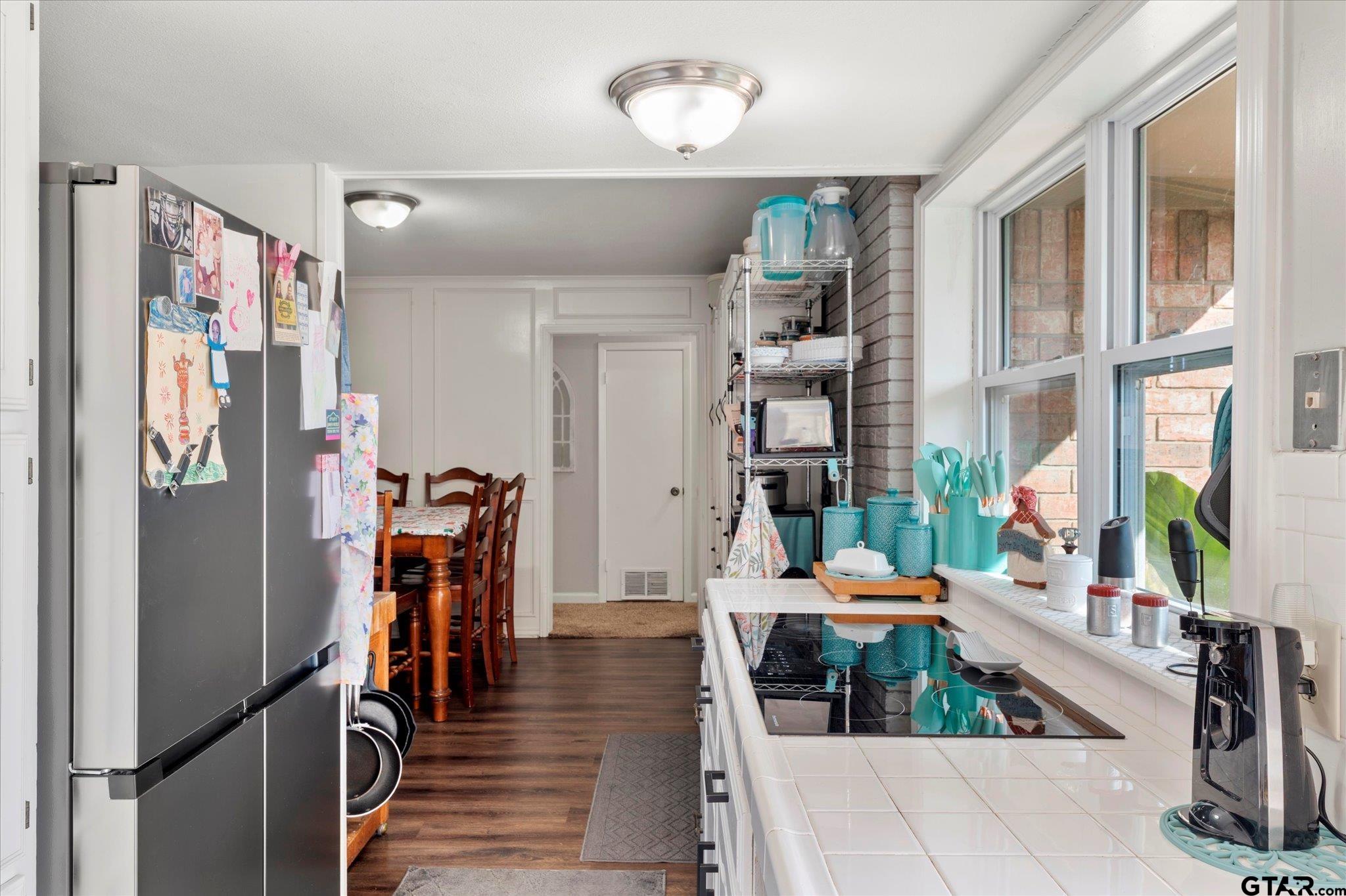 337 Daingerfield Street Pittsburg, TX 75686 - Photo 19 of 40 a living room with furniture large window and wooden floor