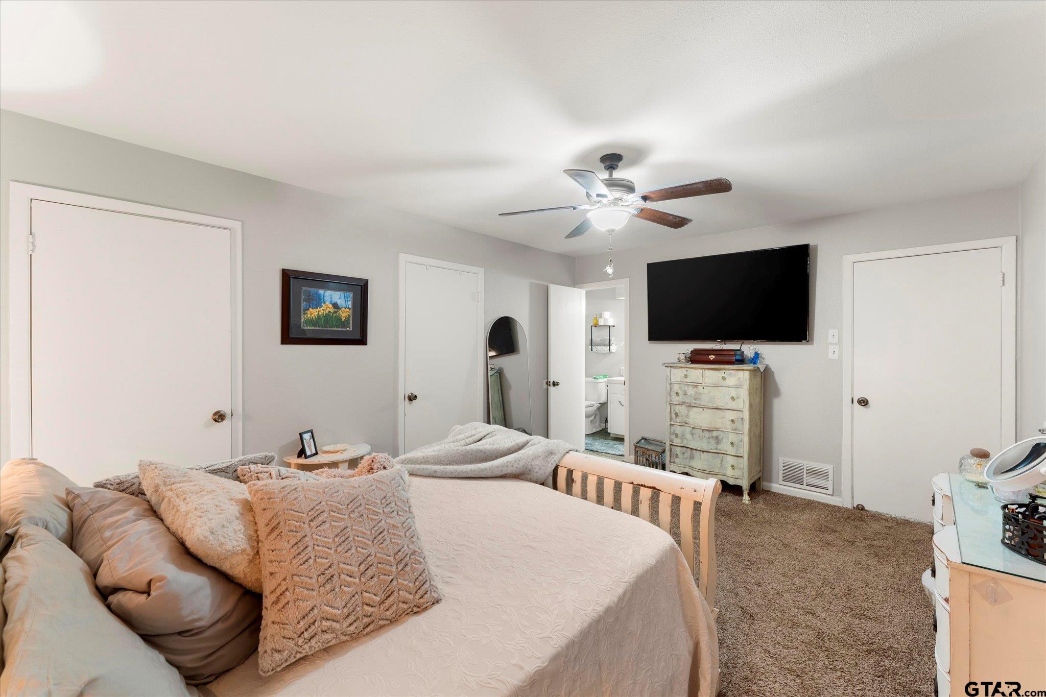 337 Daingerfield Street Pittsburg, TX 75686 - Photo 24 of 40 a bedroom with a bed and a flat screen tv