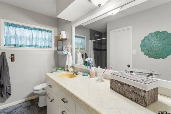 a bathroom with a sink and a washing machine