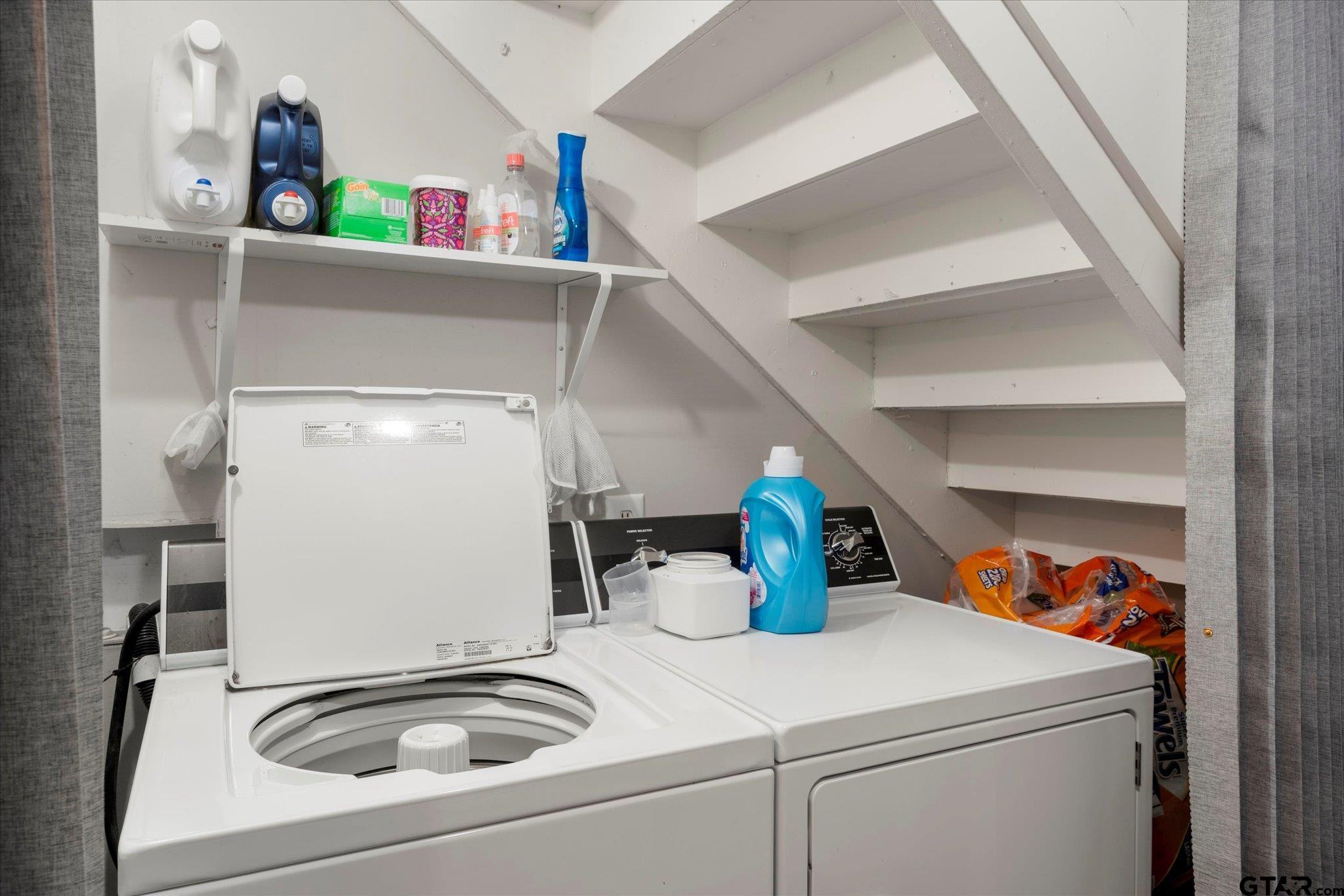 337 Daingerfield Street Pittsburg, TX 75686 - Photo 35 of 40 a bathroom with a sink and a washing machine