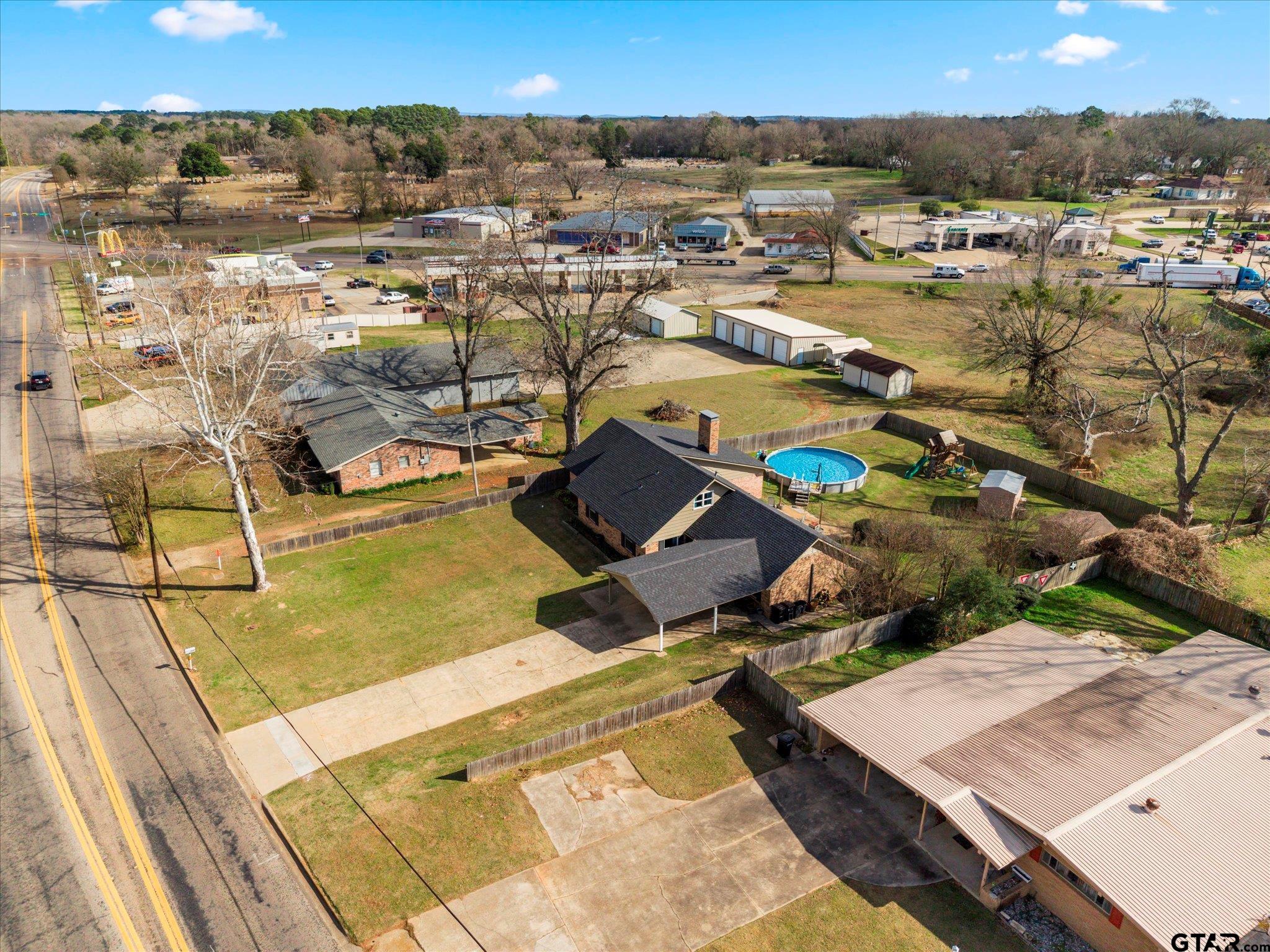 337 Daingerfield Street Pittsburg, TX 75686 - Photo 36 of 40 an aerial view of residential houses with outdoor space