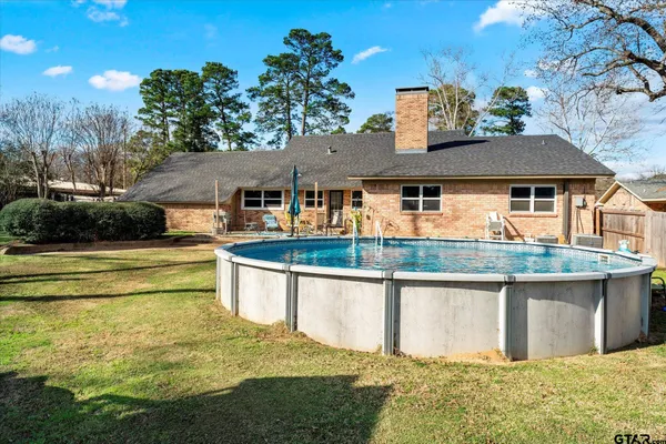 a front view of a house with swimming pool