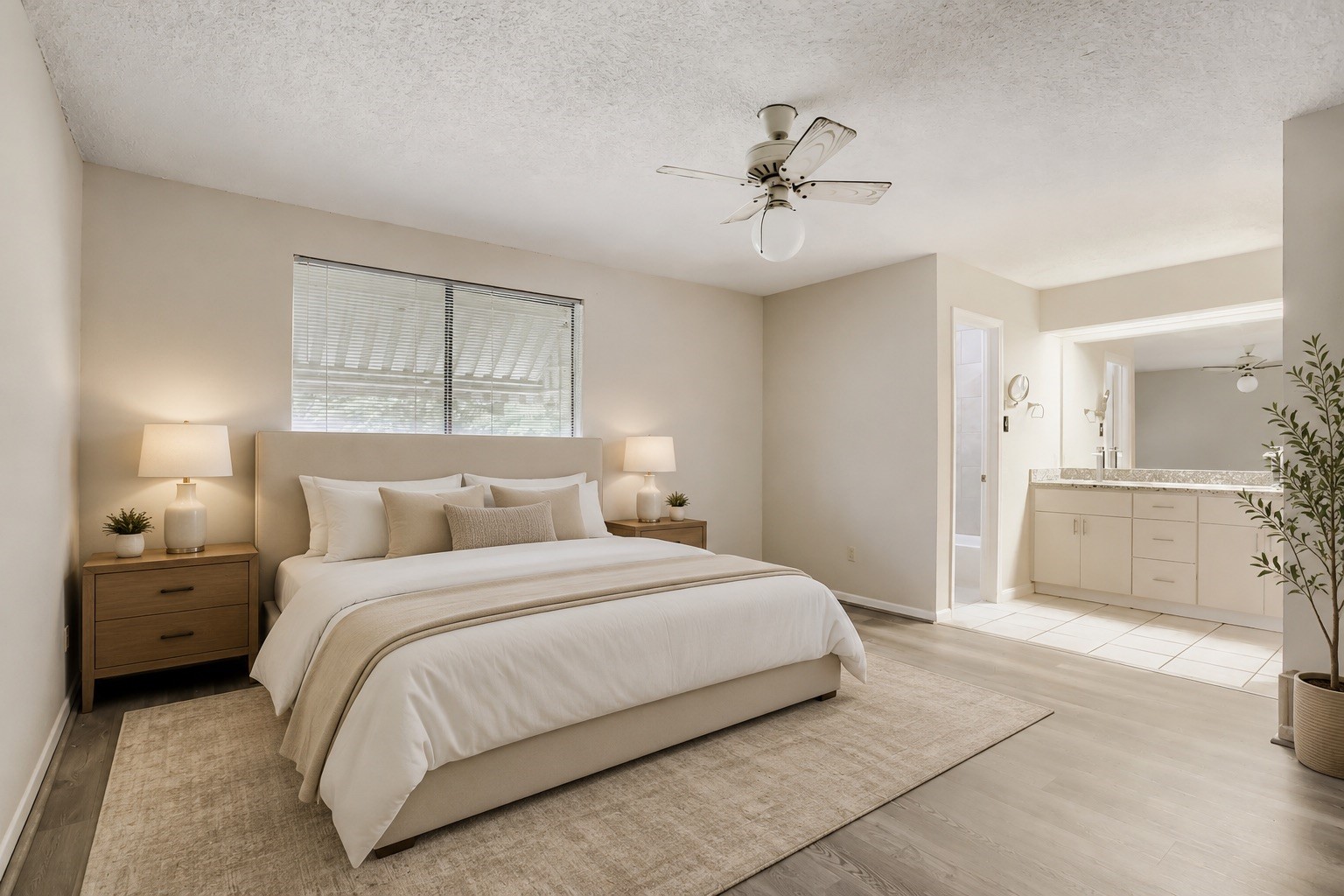 10103 Inwood Shadows Street Houston, TX 77088 - Photo 15 of 32 a bedroom with a large bed and a chandelier