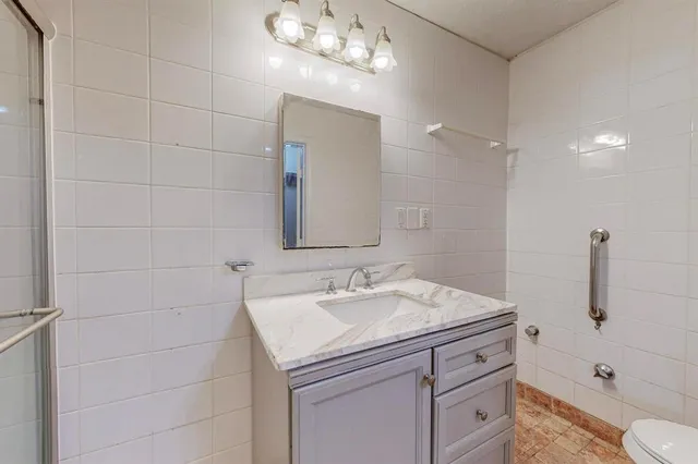 a bathroom with a sink a vanity and a mirror