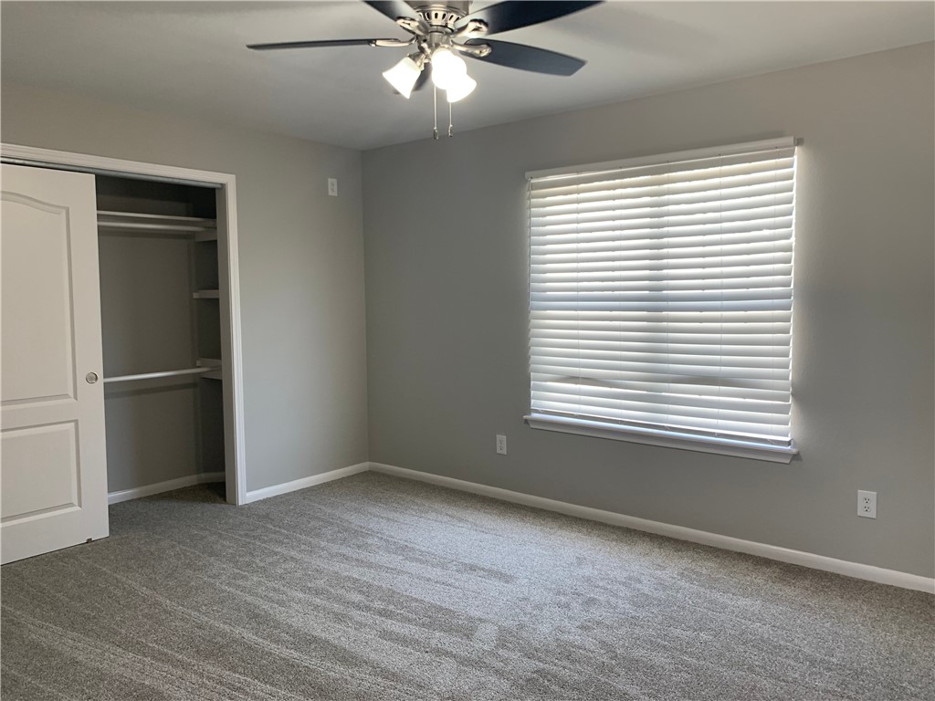 904 Cunningham Street Corpus Christi, TX 78411 - Photo 14 of 16 a view of an empty room with a window and wooden floor