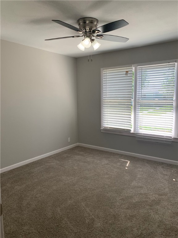 904 Cunningham Street Corpus Christi, TX 78411 - Photo 8 of 16 a view of an empty room with a window
