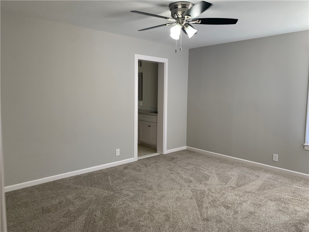 904 Cunningham Street Corpus Christi, TX 78411 - Photo 10 of 16 an empty room with a fan and a fan