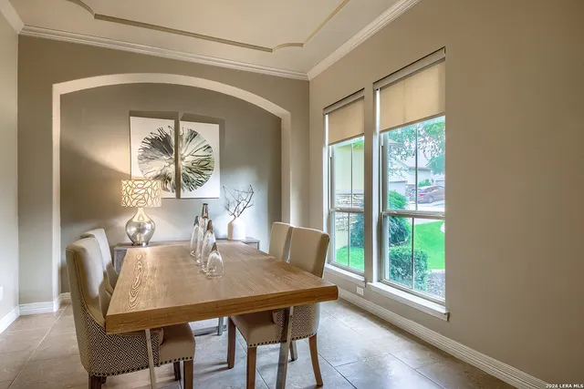 a view of a dining room with furniture window and outside view