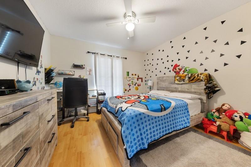 4145 Bluff Harbor Way Wellington, FL 33449 - Photo 12 of 16 a very nice looking bedroom with a bed and a dresser