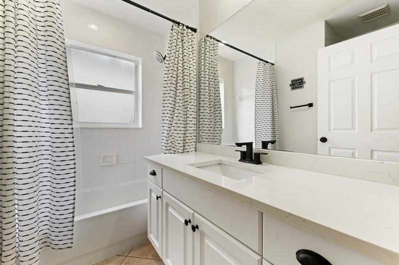4145 Bluff Harbor Way Wellington, FL 33449 - Photo 13 of 16 a bathroom with a bathtub and a sink