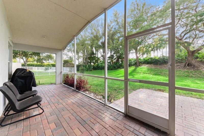 4145 Bluff Harbor Way Wellington, FL 33449 - Photo 14 of 16 a view of a yard with porch and wooden floor