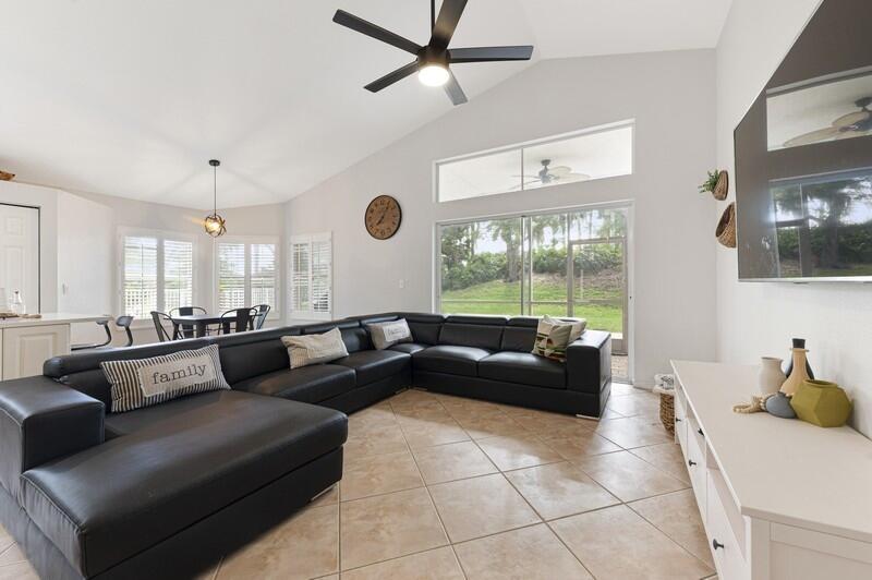 4145 Bluff Harbor Way Wellington, FL 33449 - Photo 4 of 16 a living room with furniture and a large window