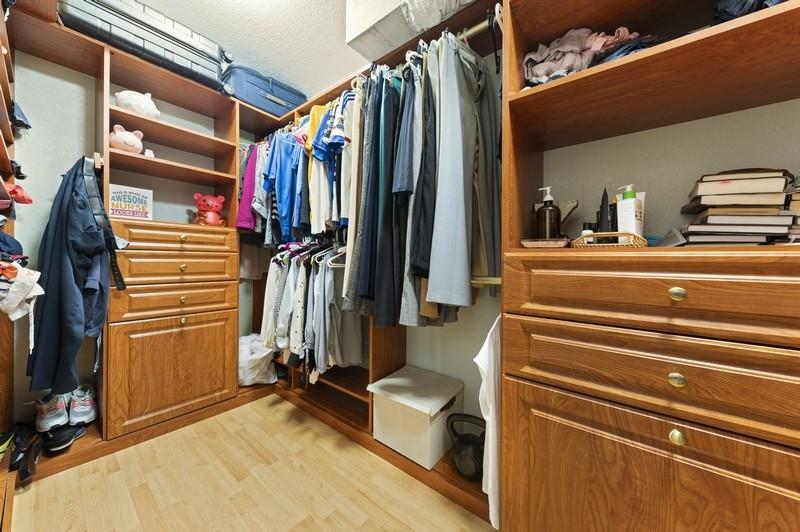 4145 Bluff Harbor Way Wellington, FL 33449 - Photo 9 of 16 a view of walk in closet with clothes and shoes