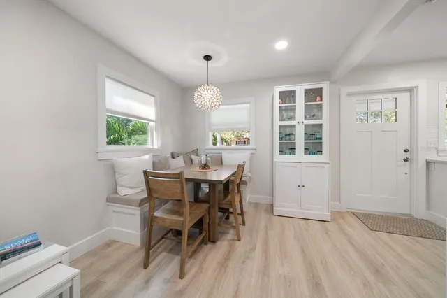 a view of a dining room with furniture and window
