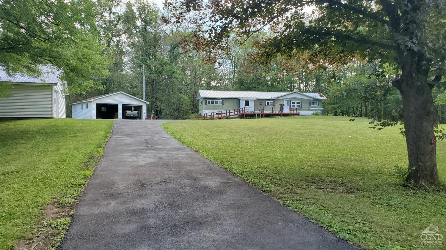 a front view of a house with yard