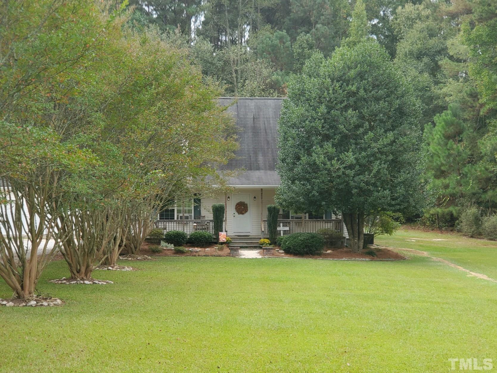 200 Landmark Road Willow Spring, NC 27592 - Photo 1 of 25 a view of a building with a garden