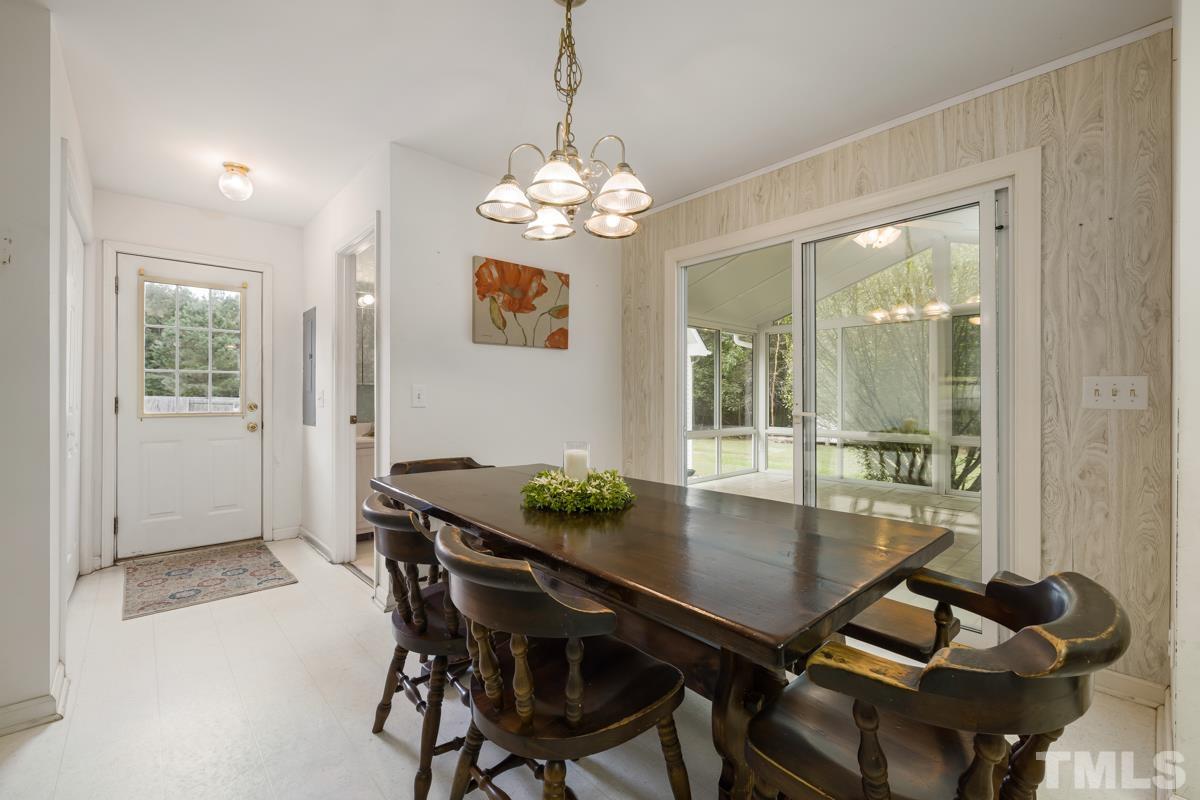 200 Landmark Road Willow Spring, NC 27592 - Photo 13 of 25 a dining room with furniture and window