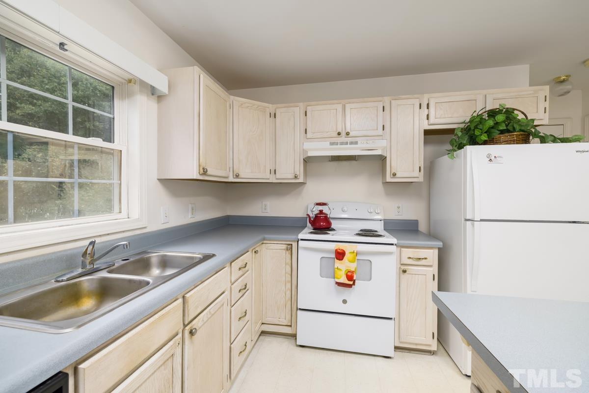 200 Landmark Road Willow Spring, NC 27592 - Photo 15 of 25 a utility room with cabinets washer and dryer
