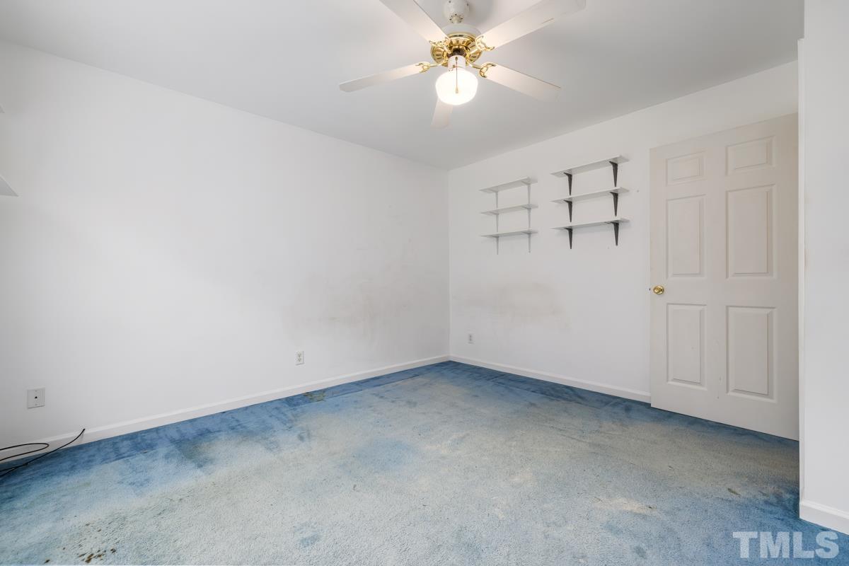 200 Landmark Road Willow Spring, NC 27592 - Photo 19 of 25 an empty room with a view of a bathroom