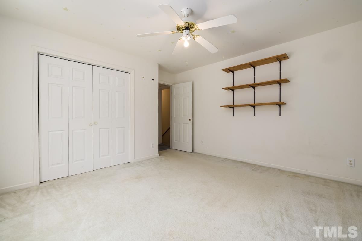 200 Landmark Road Willow Spring, NC 27592 - Photo 23 of 25 a view of a room with a ceiling fan and a window