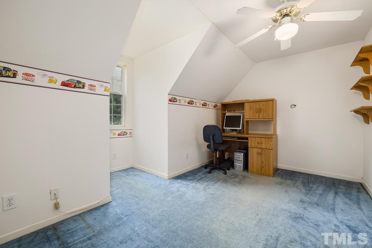 200 Landmark Road Willow Spring, NC 27592 - Photo 24 of 25 a view of a workspace with furniture and a window