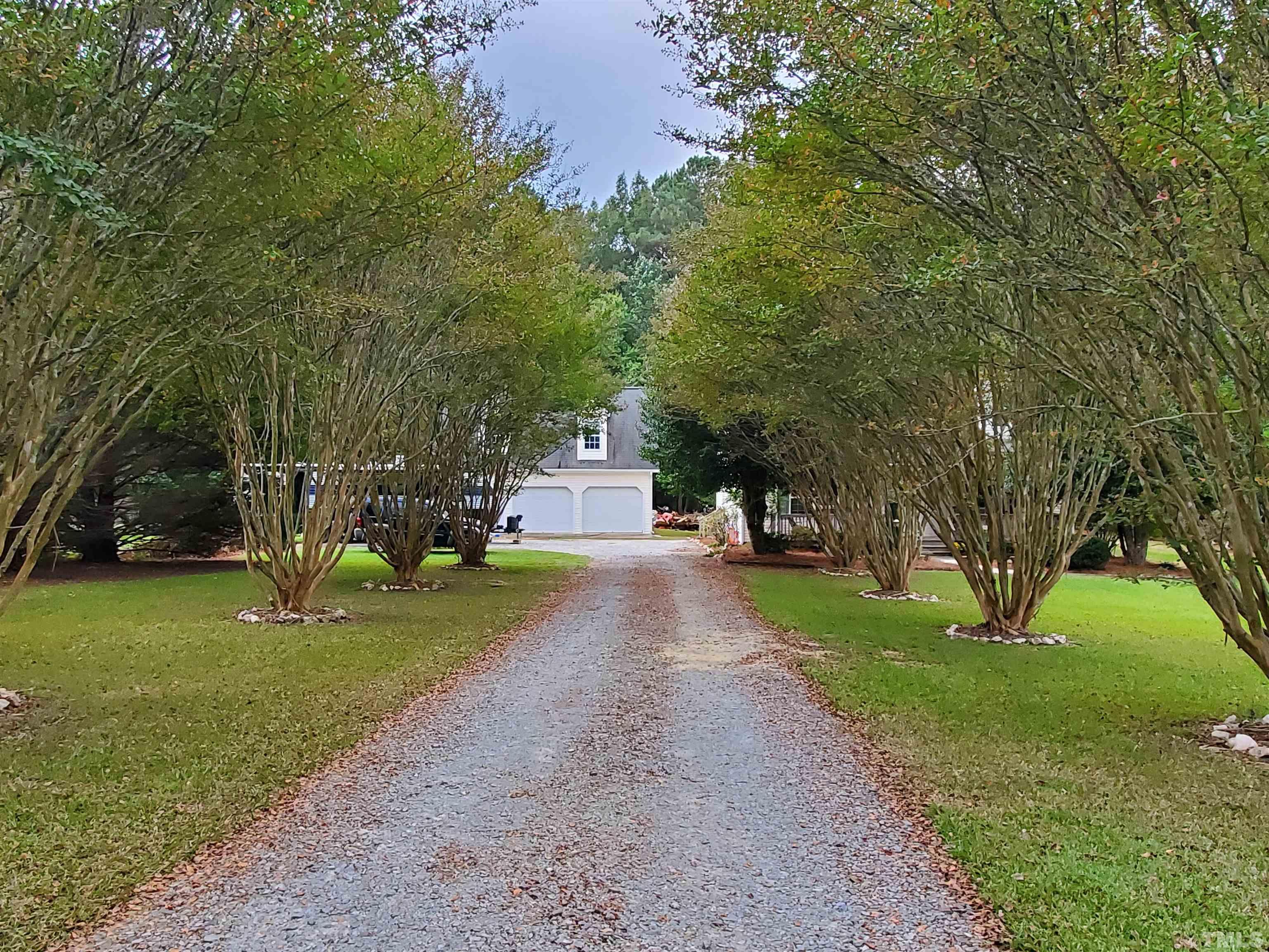 200 Landmark Road Willow Spring, NC 27592 - Photo 4 of 25 a view of a park with large trees