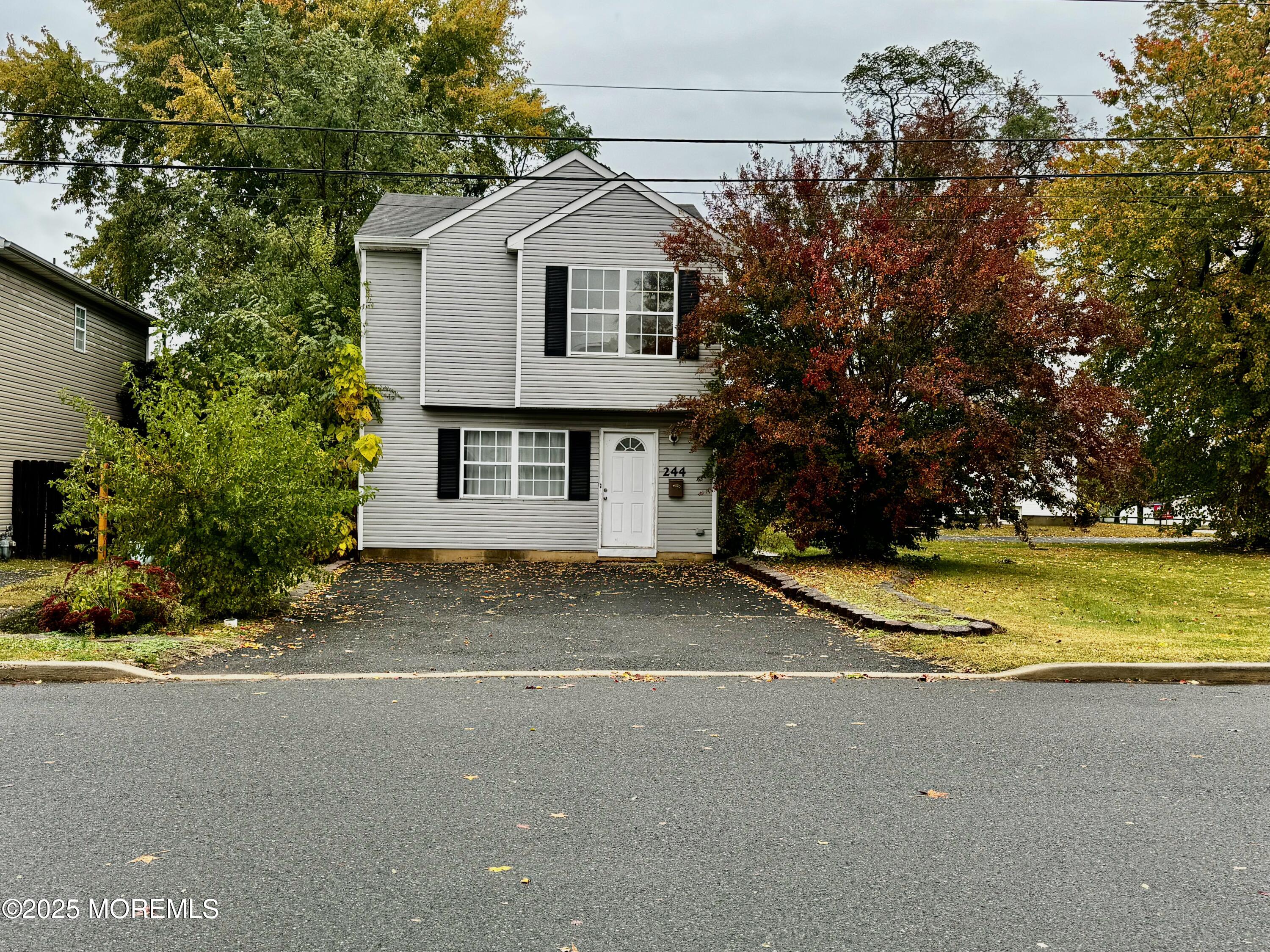244 Raritan Street Keyport, NJ 07735 - Photo 1 of 18 a view of a house with a yard and garage