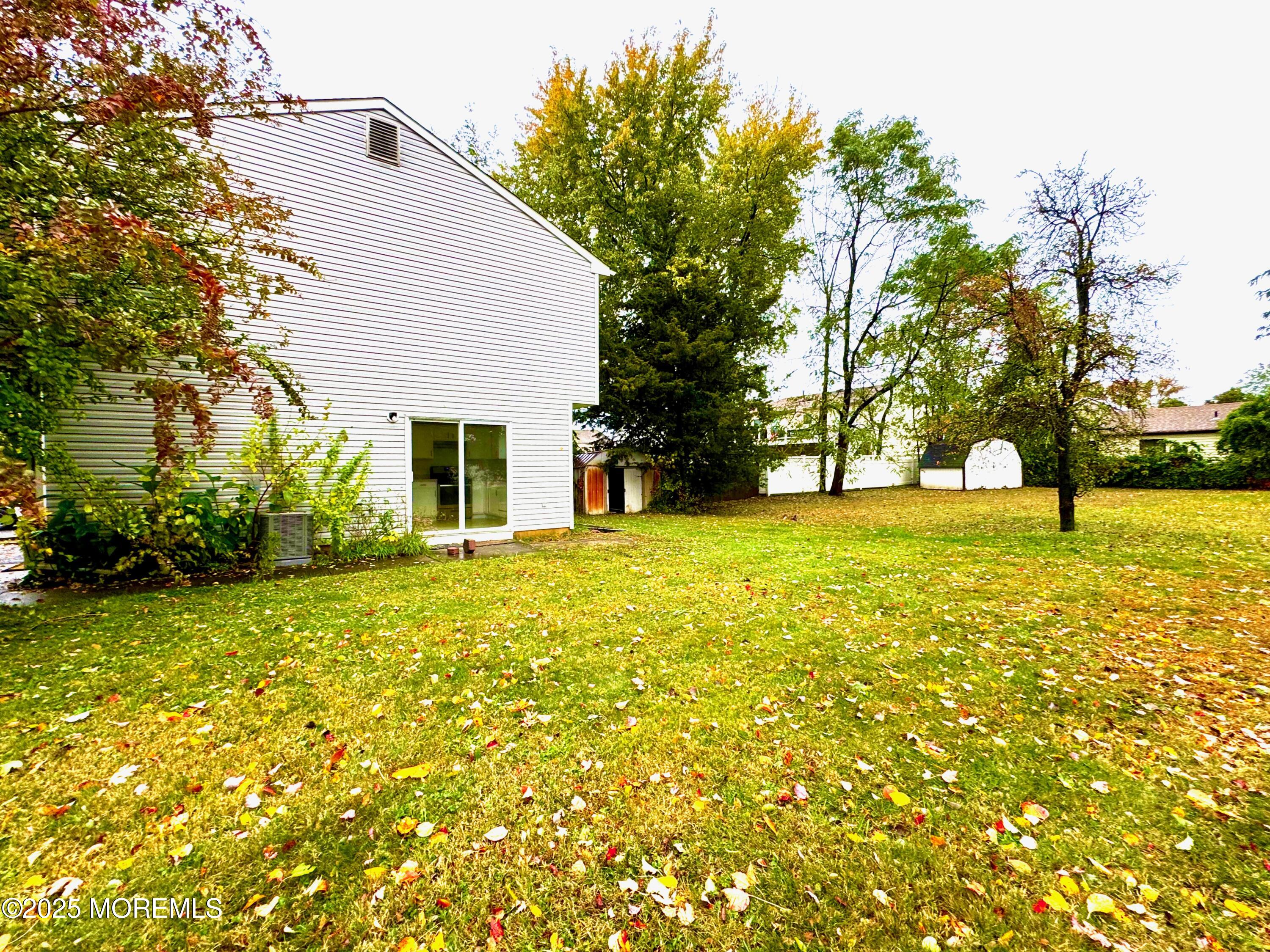 244 Raritan Street Keyport, NJ 07735 - Photo 18 of 18 a view of a house with a yard and tree s