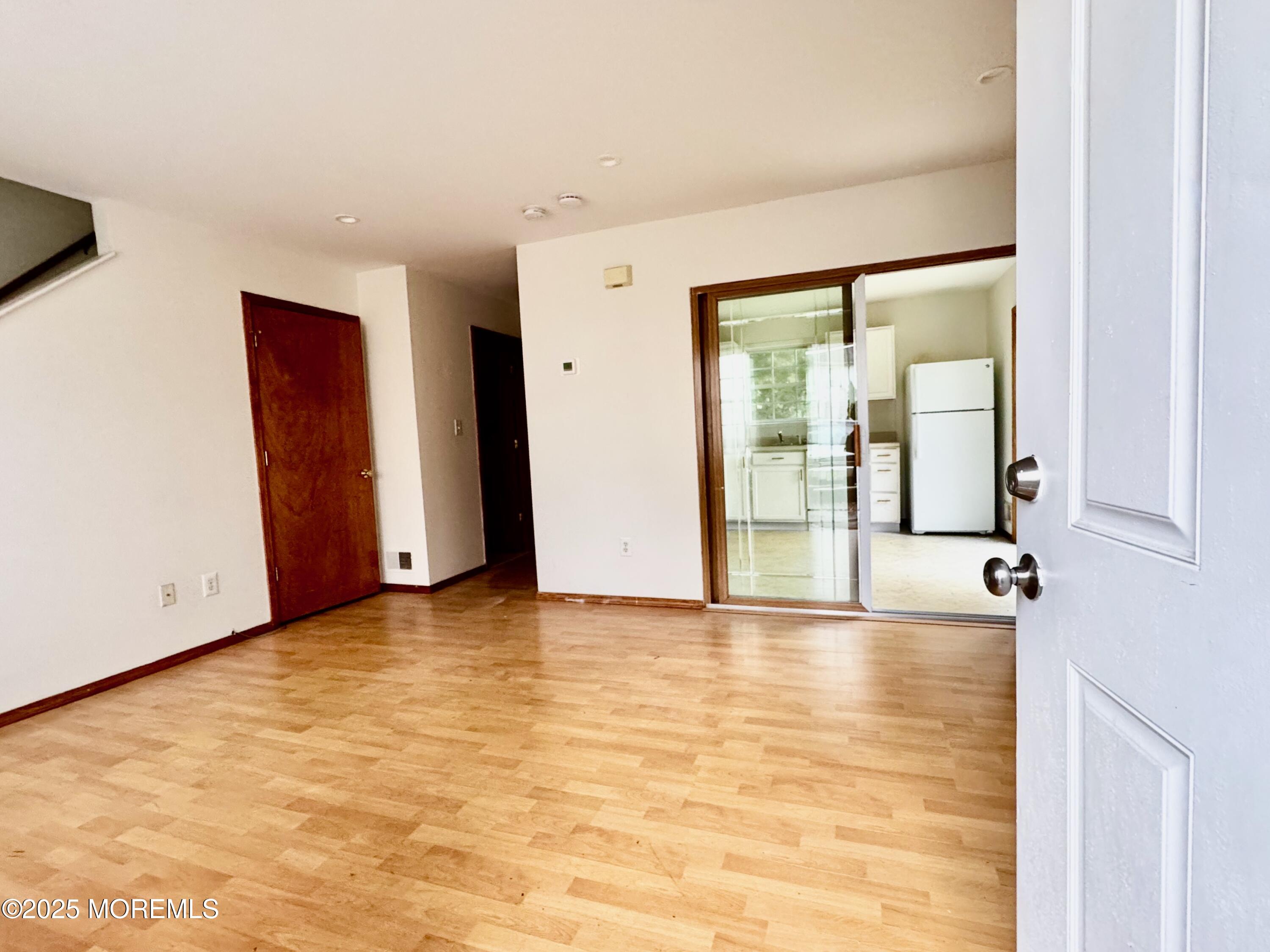 244 Raritan Street Keyport, NJ 07735 - Photo 4 of 18 a view of an empty room with glass door