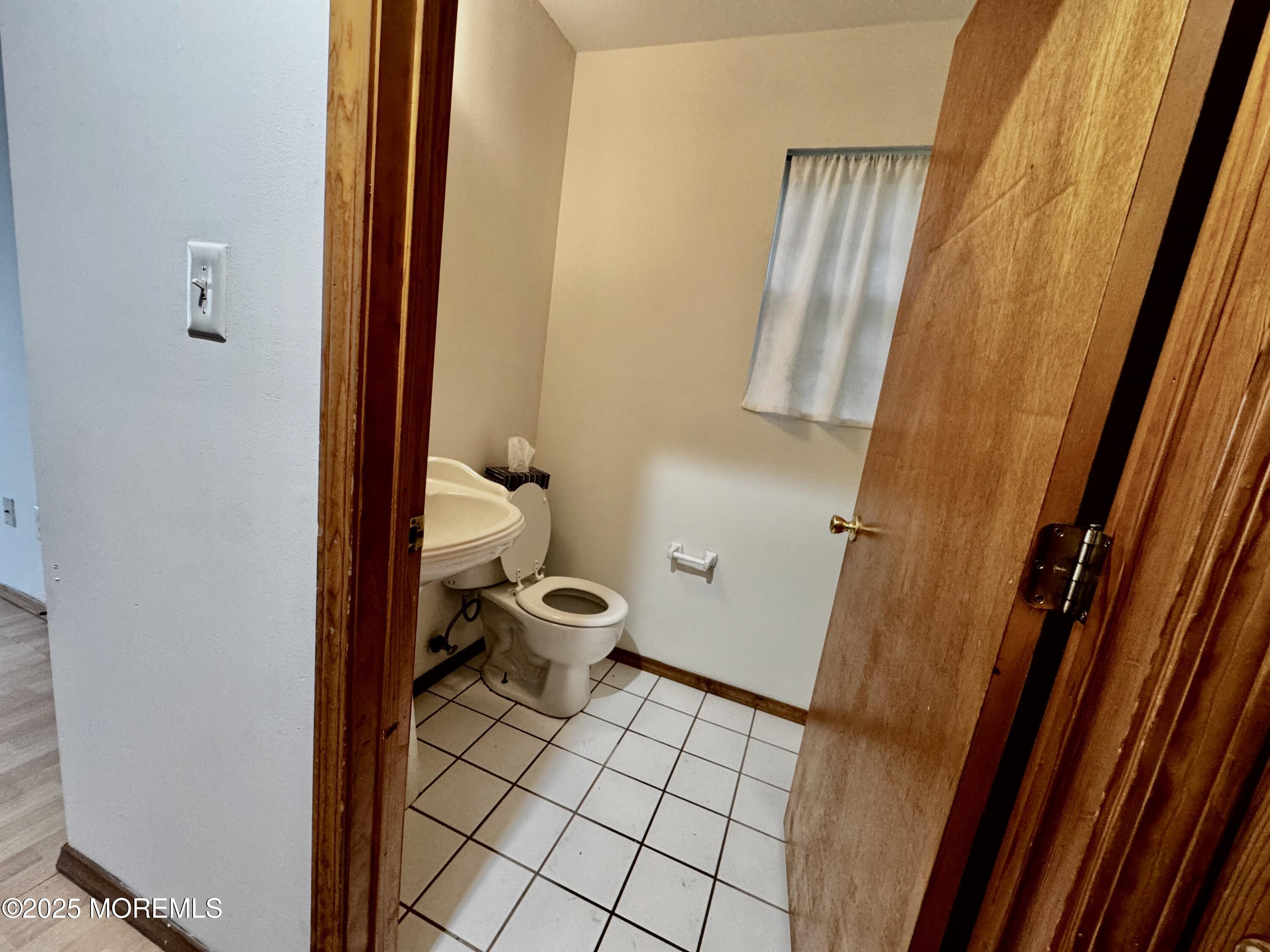 244 Raritan Street Keyport, NJ 07735 - Photo 8 of 18 a bathroom with a sink and a toilet