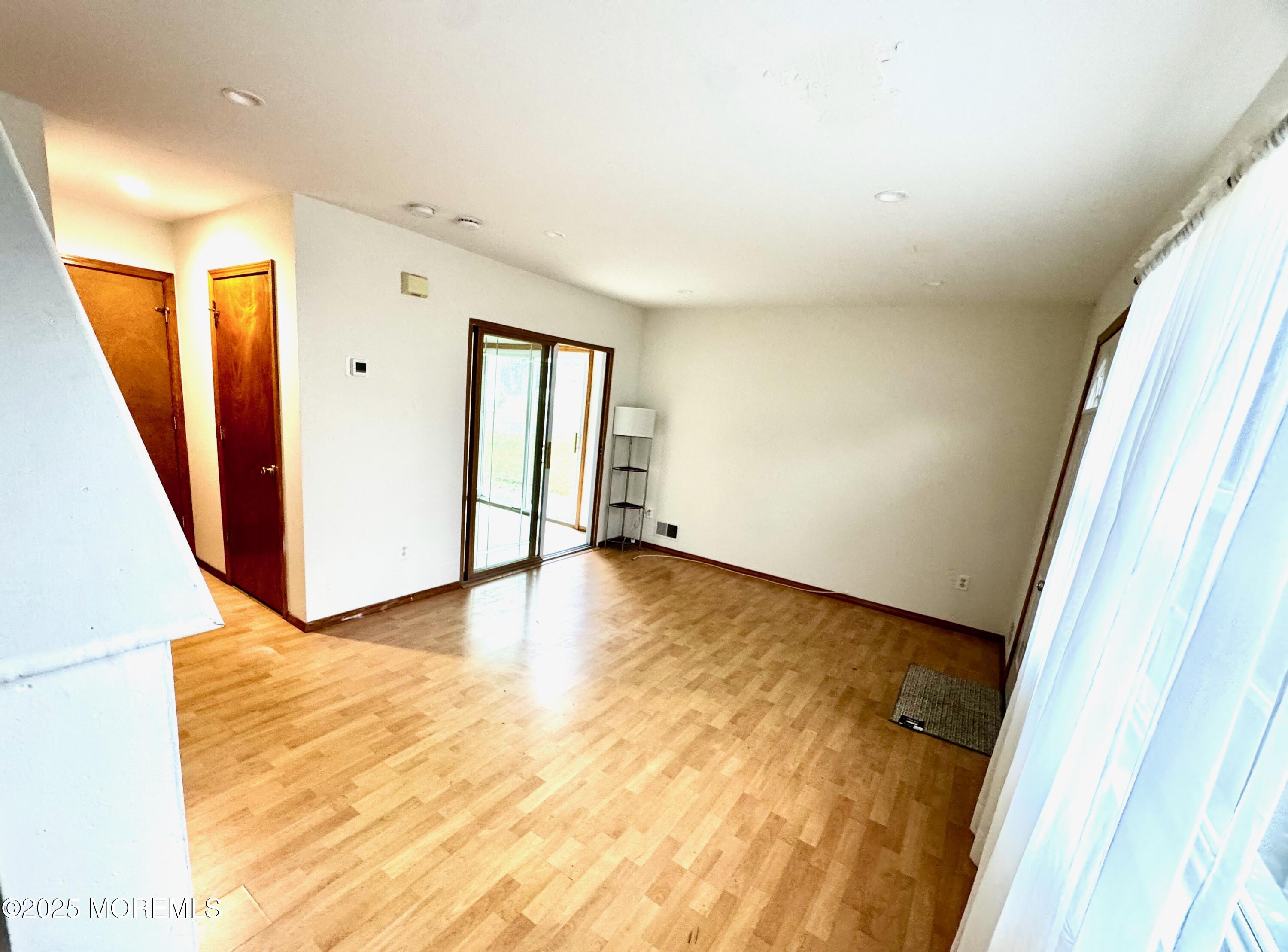 244 Raritan Street Keyport, NJ 07735 - Photo 10 of 18 a view of an empty room with wooden floor