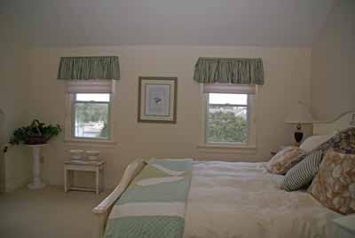 326 Morris Island Road Chatham, MA 02633 - Photo 17 of 34 a bedroom with a bed and a window