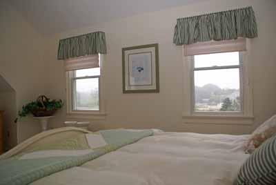 326 Morris Island Road Chatham, MA 02633 - Photo 24 of 34 a bedroom with a bed and window