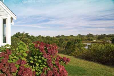326 Morris Island Road Chatham, MA 02633 - Photo 29 of 34 a view of a lake with a house in the background