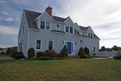 326 Morris Island Road Chatham, MA 02633 - Photo 4 of 34 a front view of a house with garden