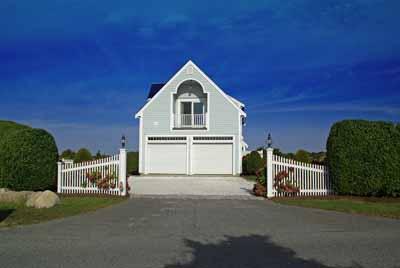 326 Morris Island Road Chatham, MA 02633 - Photo 6 of 34 a front view of a house with a yard