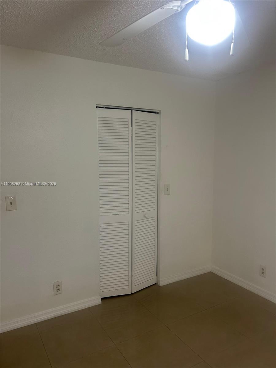 3995 West McNab Road, Unit B310 Pompano Beach, FL 33069 - Photo 10 of 10 an empty room with a window