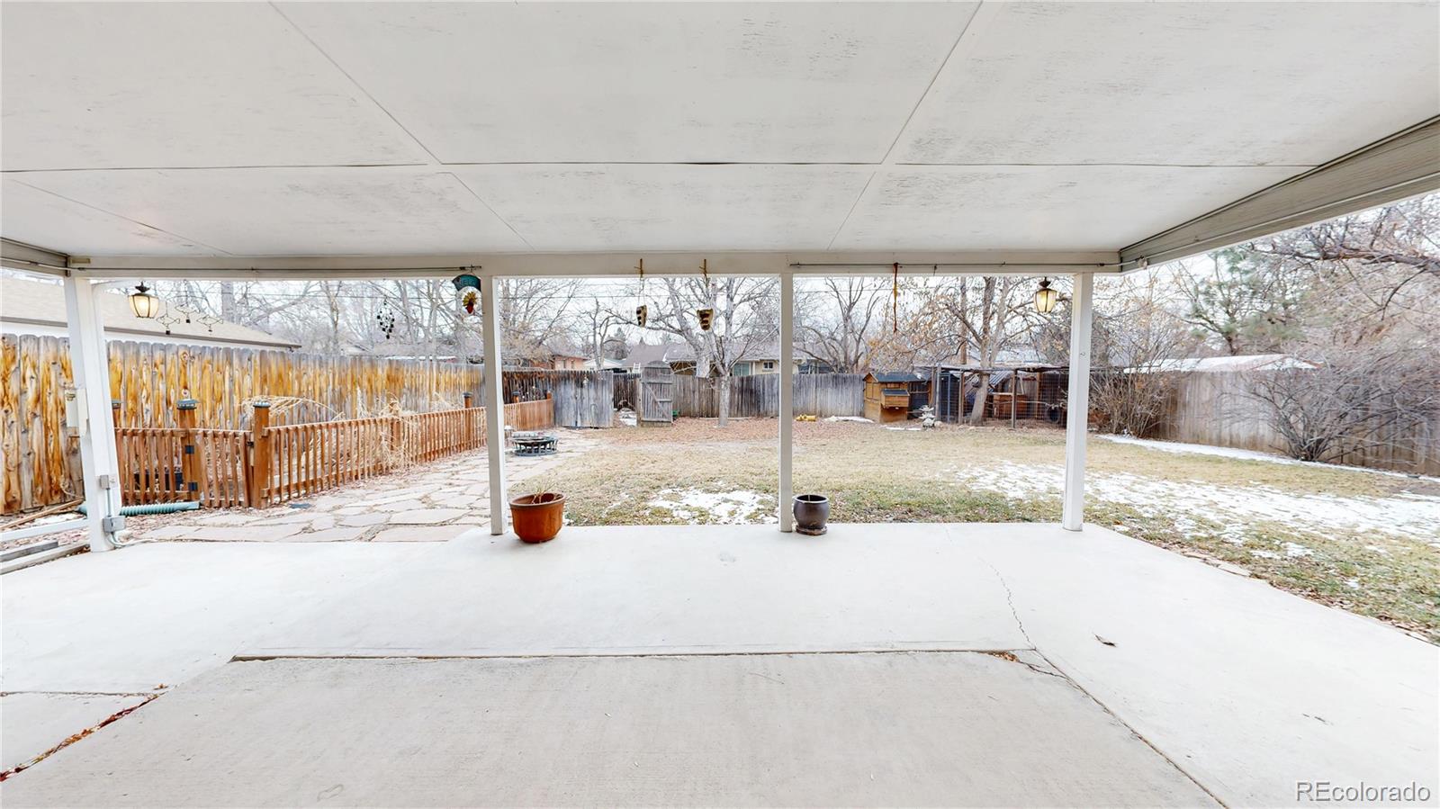 3246 South Stuart Street Denver, CO 80236 - Photo 36 of 43 an outdoor space with patio